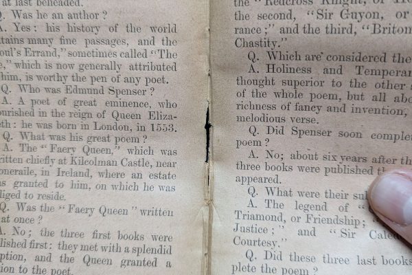 Carefully dislodging pages.