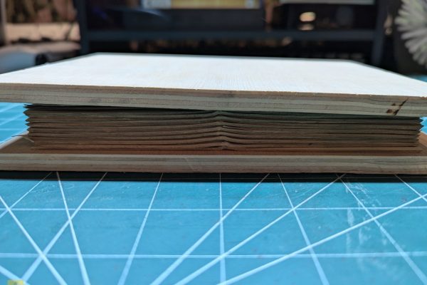 Putting the flat signatures in between boards.