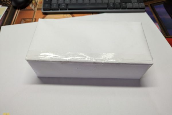 Wrapped brick in plain paper.
