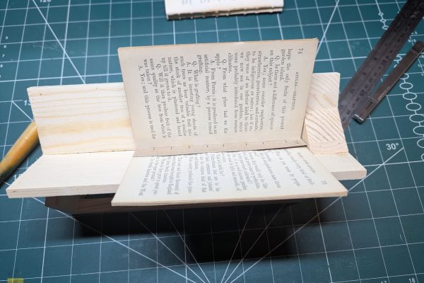 Punching holes in the signatures using my template.
