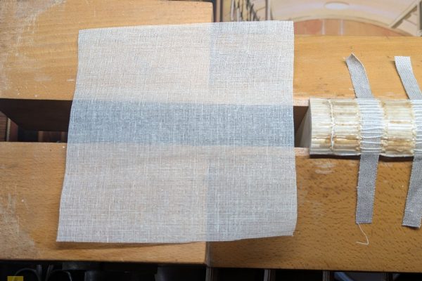 Cutting and gluing mull to the spine.