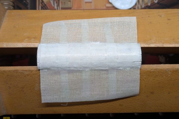 Cutting and gluing mull to the spine.