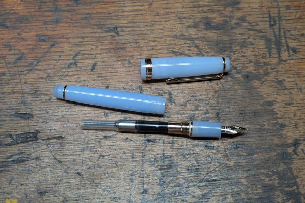 Jinhao fountain pen with the ink converter.