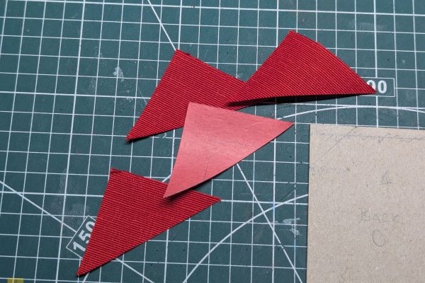 Creating the triangular edges for the cover.