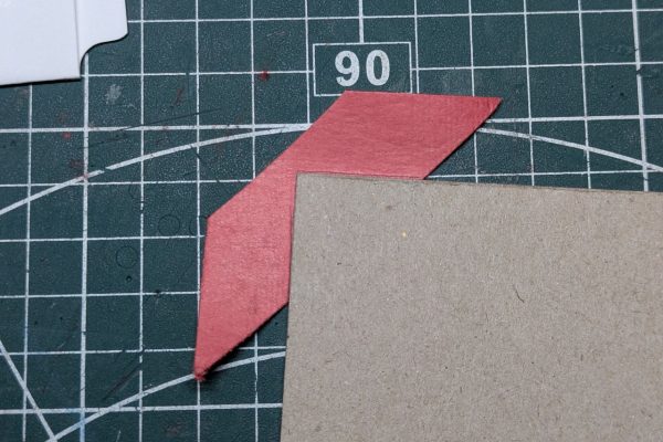 Gluing the corners to the covers.