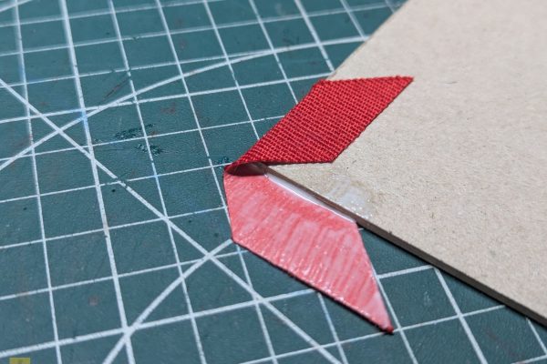 Gluing the corners to the covers.