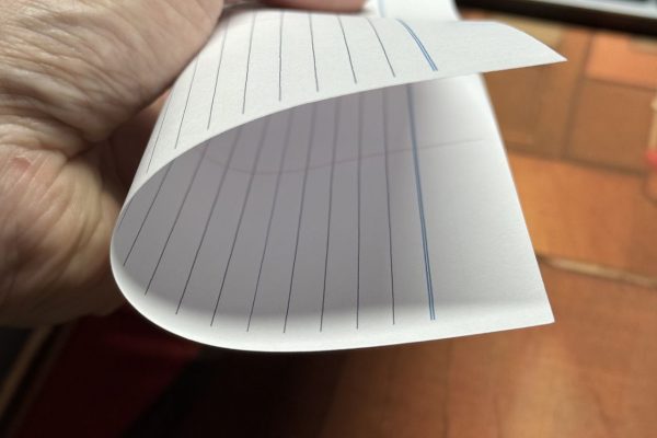 Folding paper against the grain.