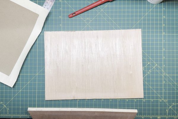Boards to press flat the cover.