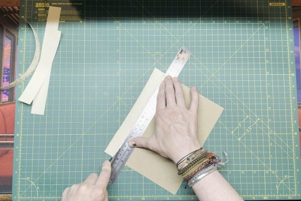 Trimming the edges to the card.