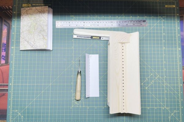 Punching cradle, alternatively the punching template and awl.