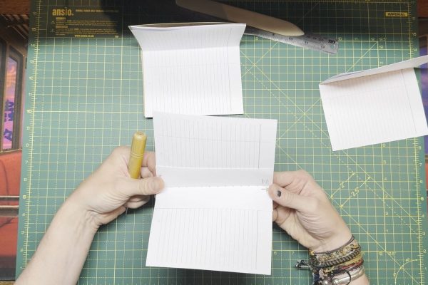 Lining up the punching template with the pages.