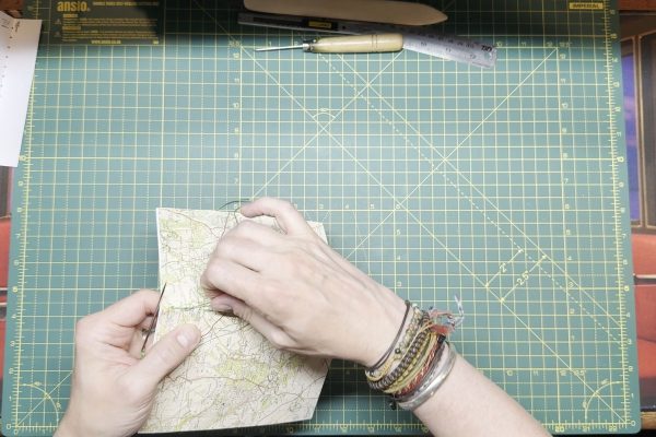 Make sure to not pierce the thread that's already been sewn.